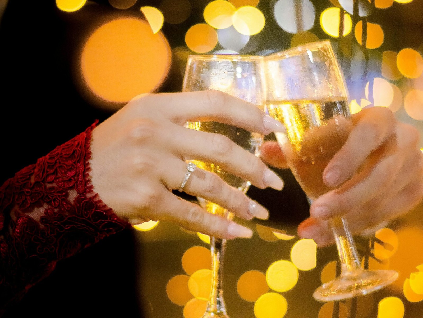 person holding clear wine person holding clear wine glass